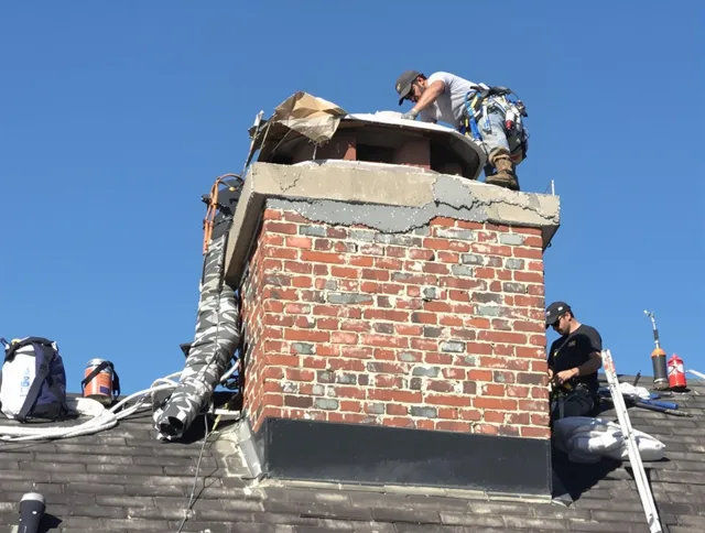 Downey Chimney Sweep installing a custom chimney crown in Downey, CA