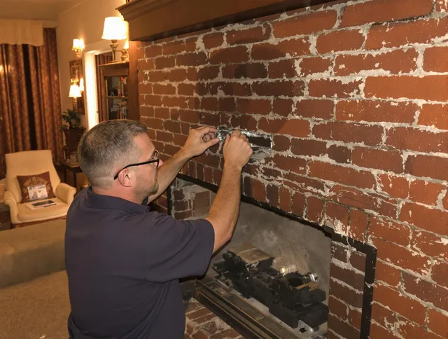 Downey Chimney Sweep expert fixing a fireplace in Downey, CA